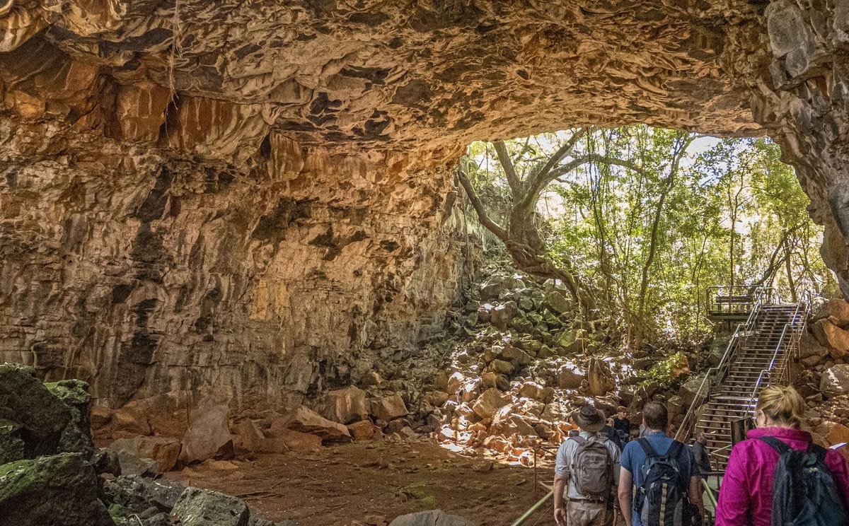 Visitors walking through the Undara lava tubes